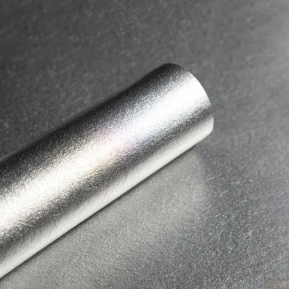 Roll of textured silver wallpaper