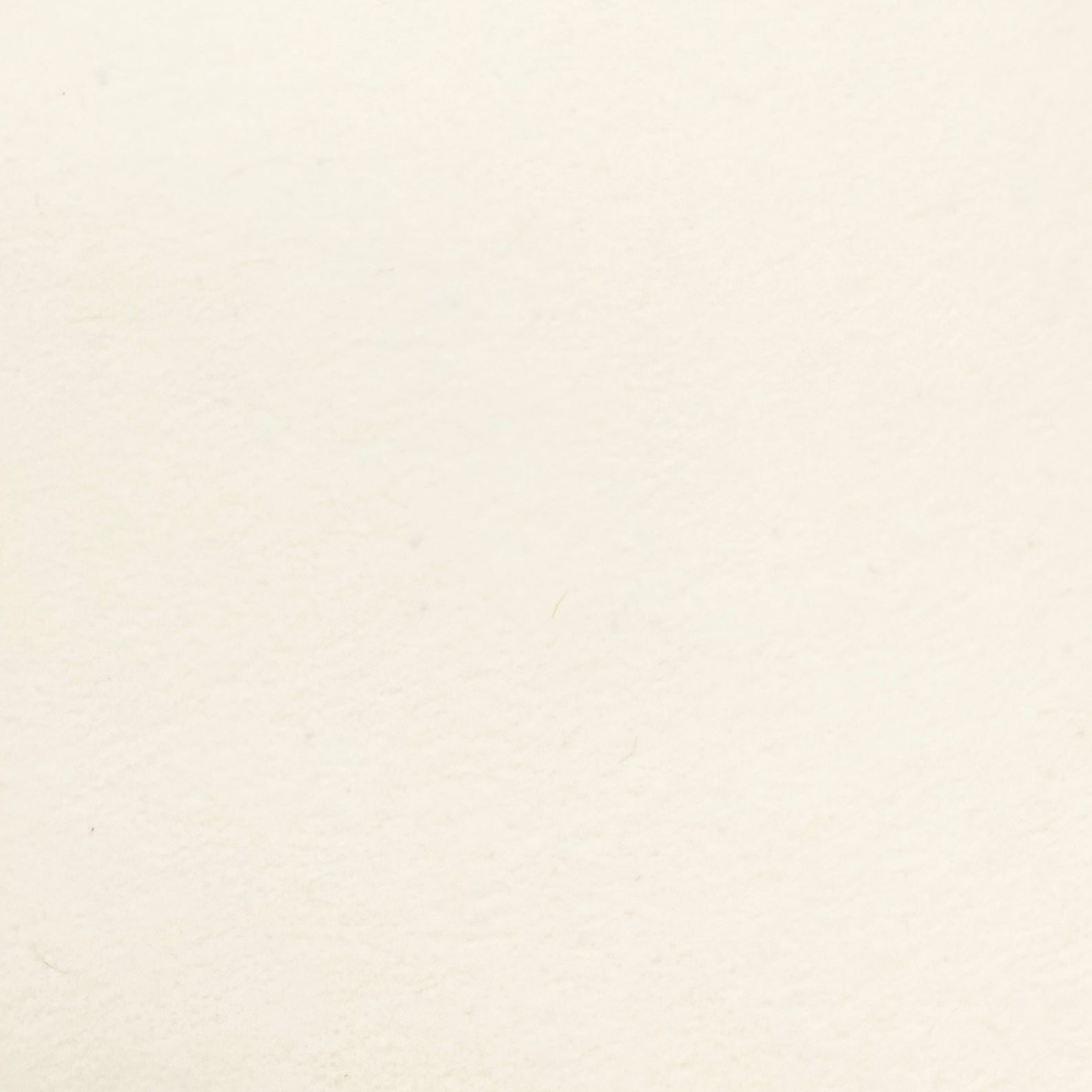 Swatch of cream wallpaper made with recycled materials