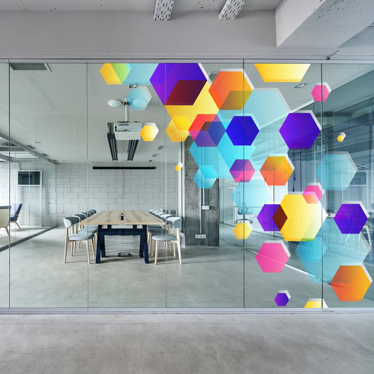Modern office with colorful geometric art on glass walls